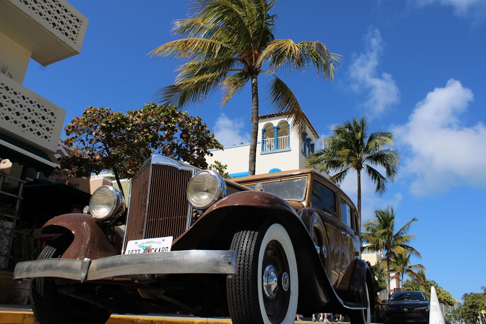 an old car parked in front of a church