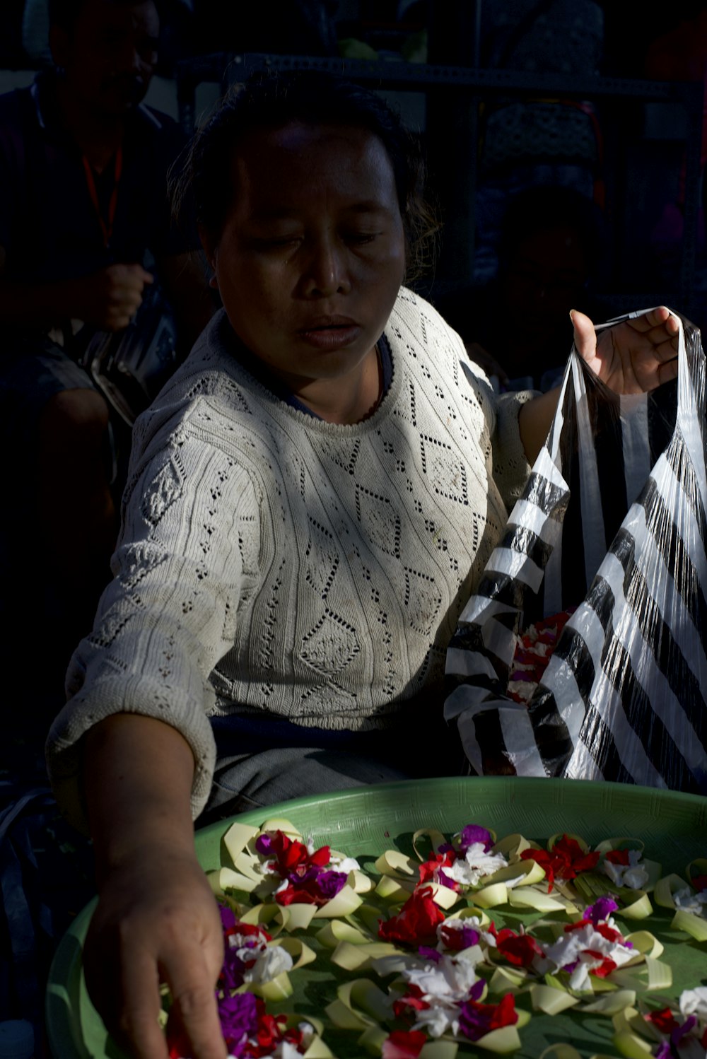 a woman sitting at a table with a plate of food