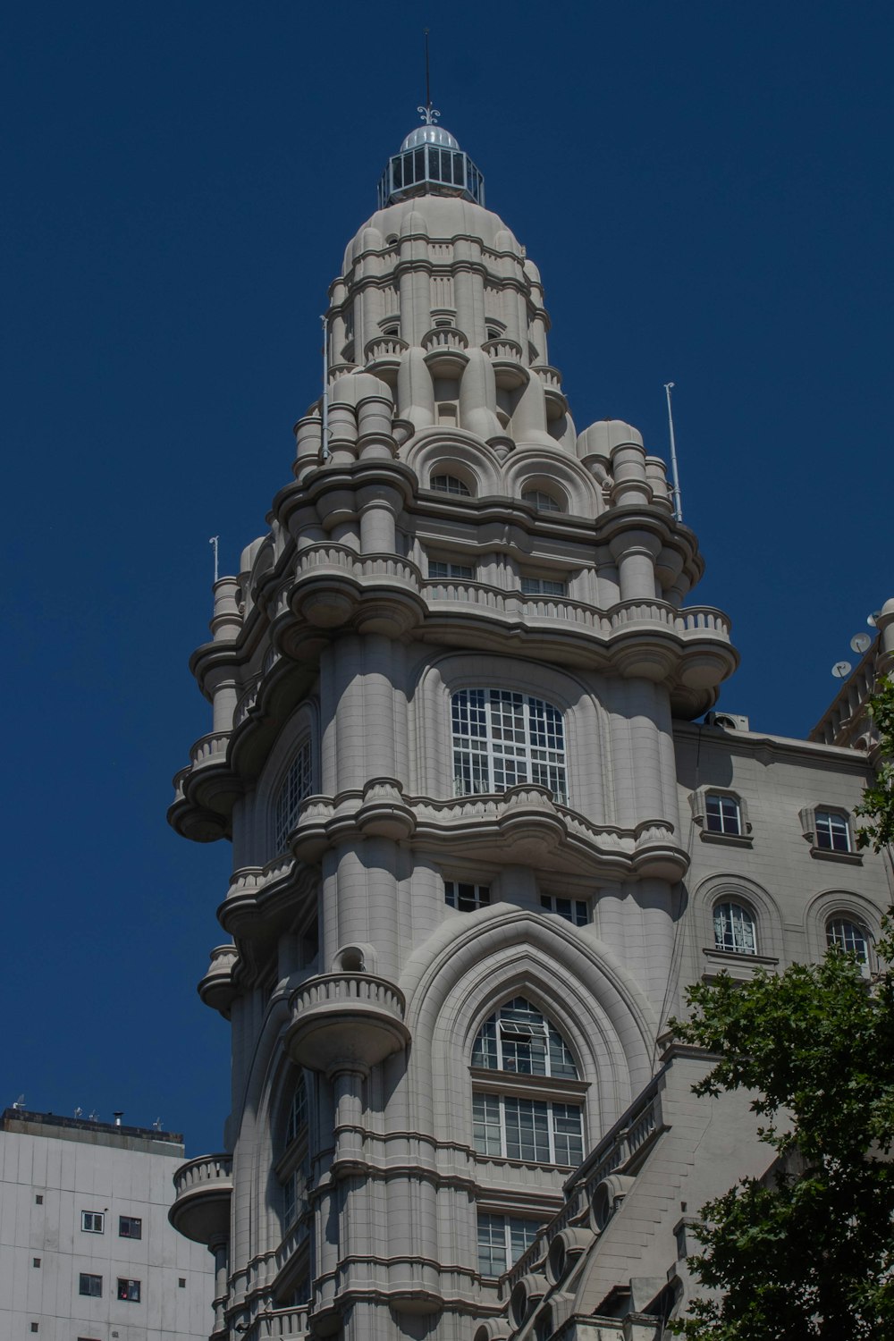 a very tall building with a clock on it's side