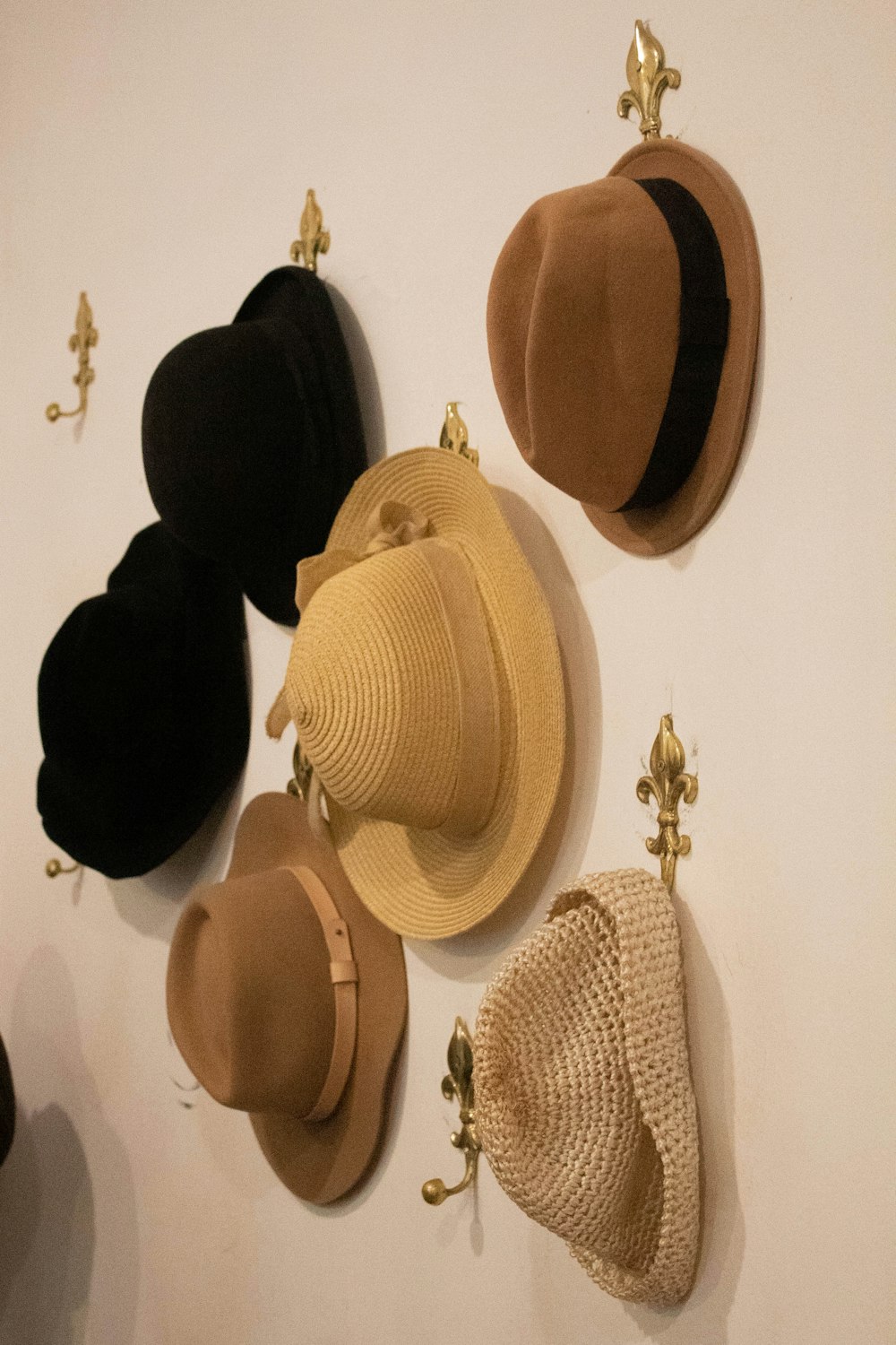 a group of hats hanging on a wall