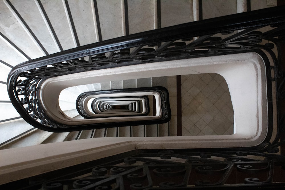 a view of a spiral staircase from the bottom