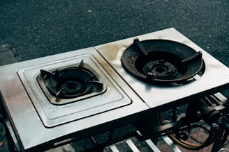 two burners sitting on top of a metal table