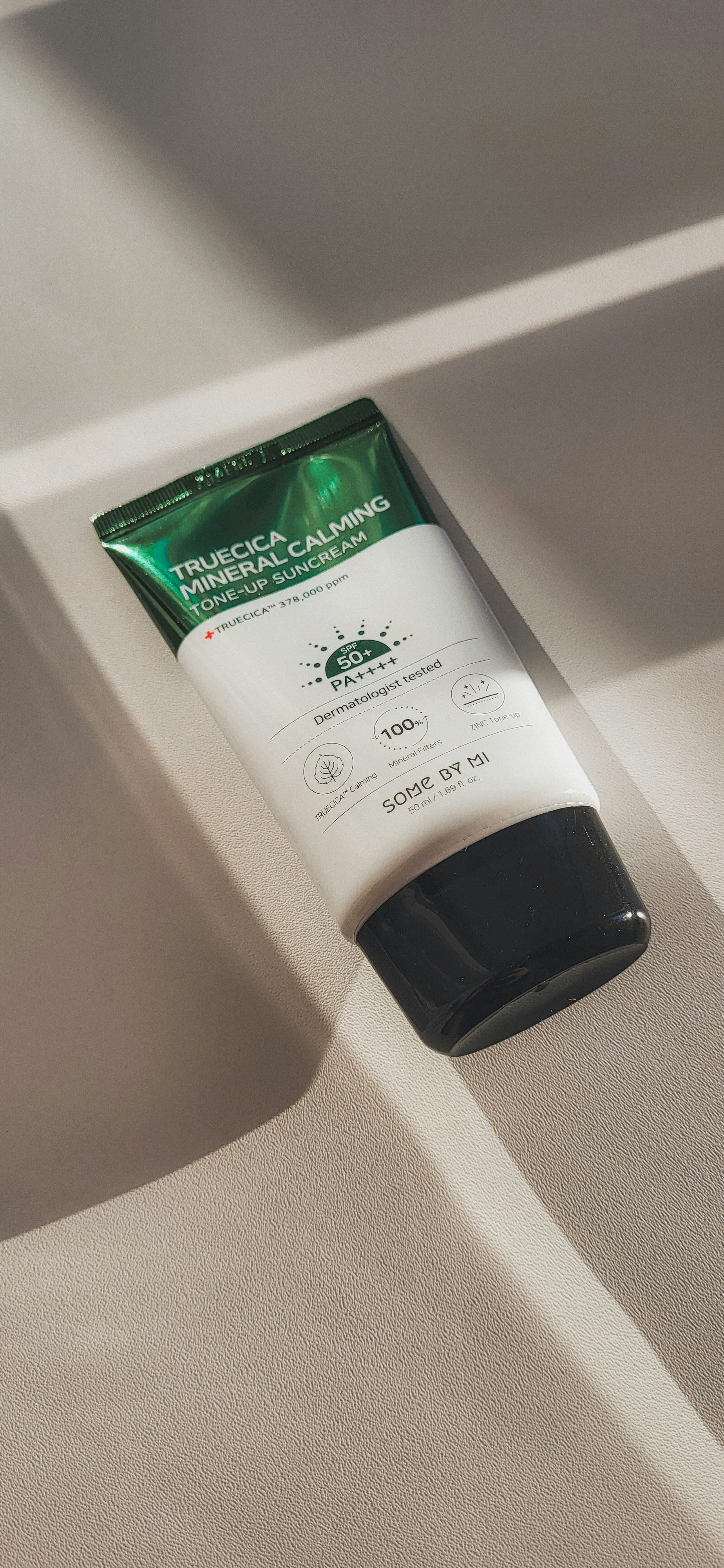 a tube of cream sitting on top of a table