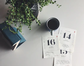 a cup of coffee sitting on top of a table