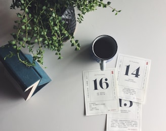 a cup of coffee sitting on top of a table