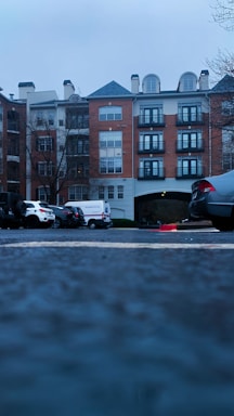 Off-street parking area beside the apartment building.