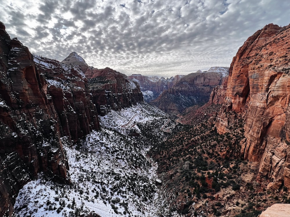 a view of a canyon with snow on the ground