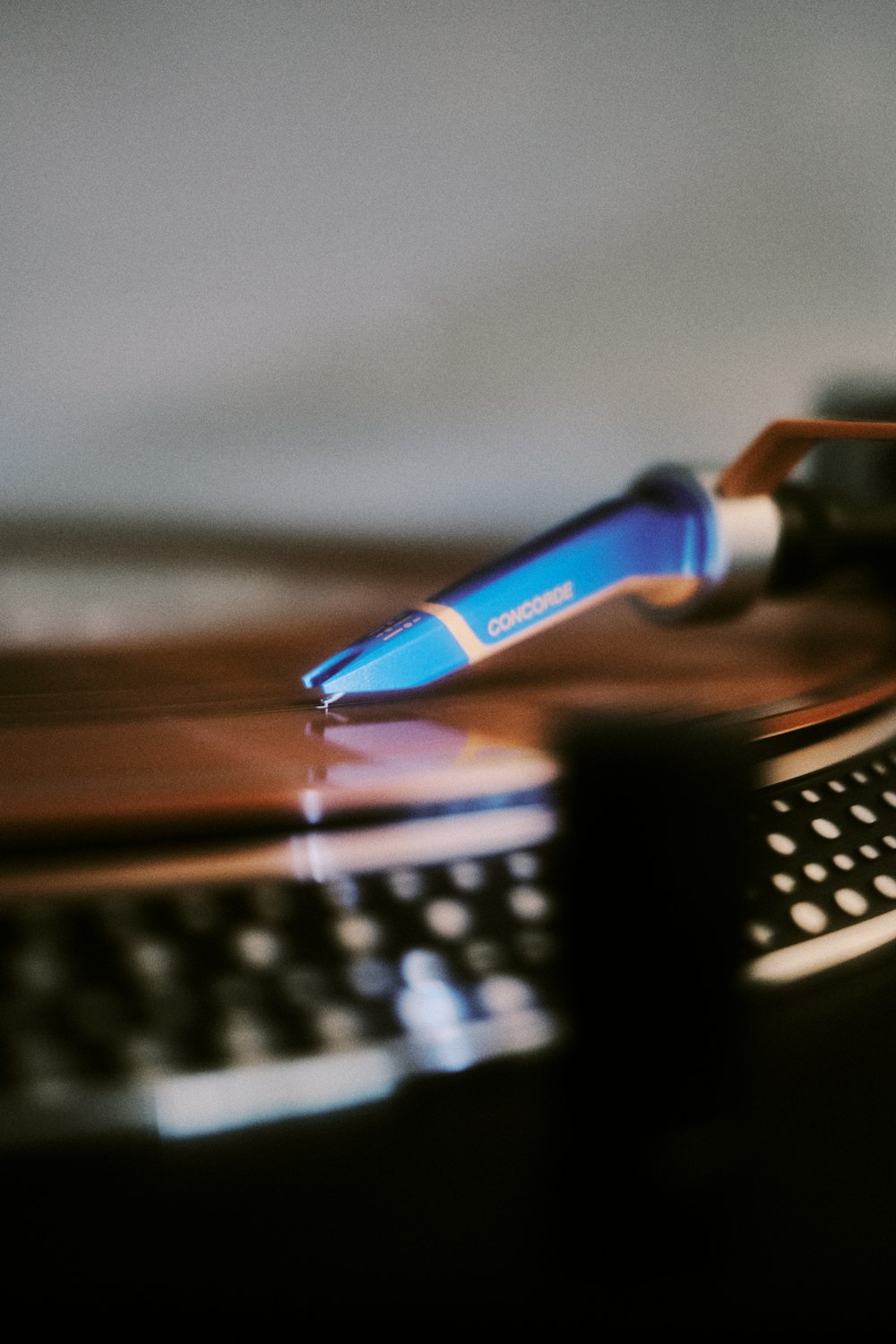 a close up of a keyboard and a pen