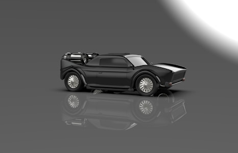 A sleek and futuristic black car with an aerodynamic design is reflected on a glossy surface. The vehicle features large, shiny wheels and an exposed engine or machinery at the rear, giving it a high-tech appearance. The background is a gradient of gray to white, adding to the modern and sophisticated look.