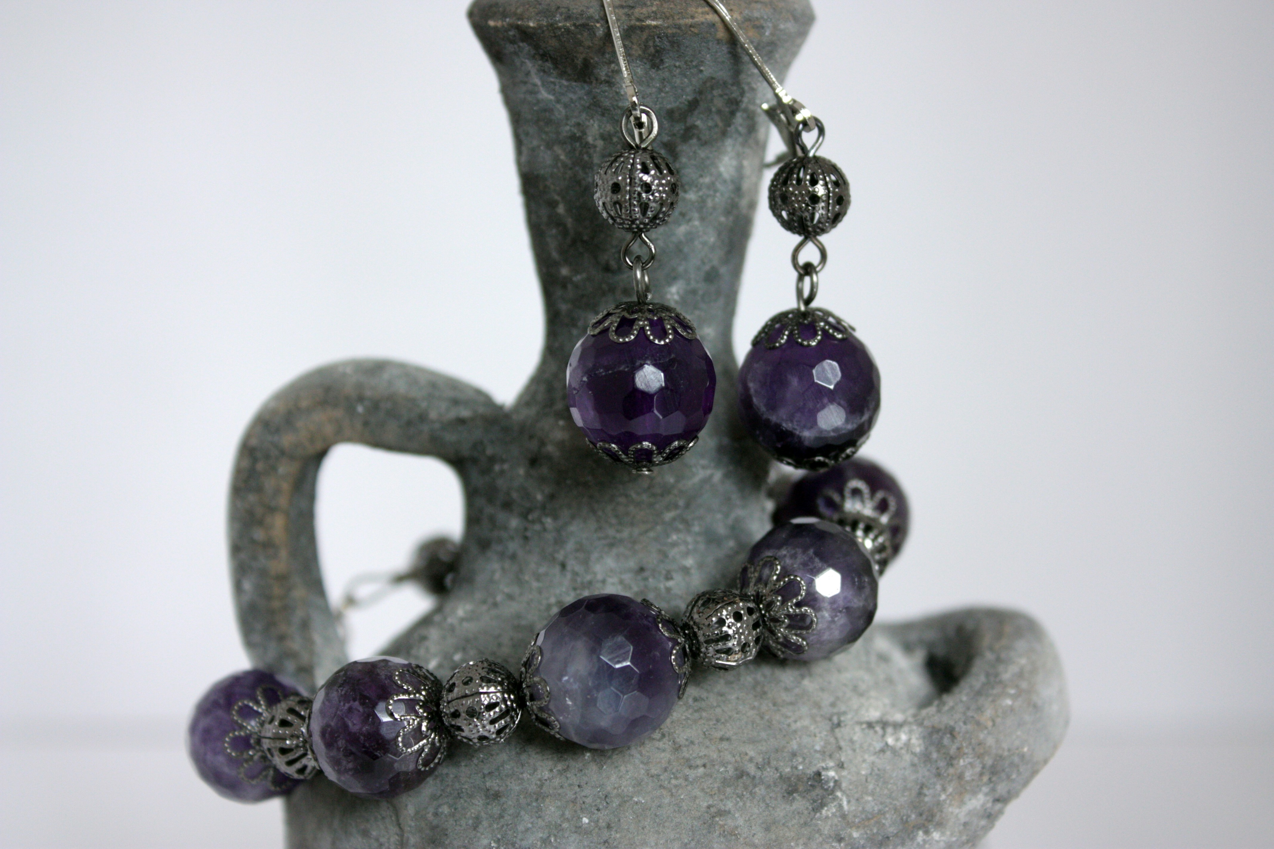 a close up of a pair of purple beads