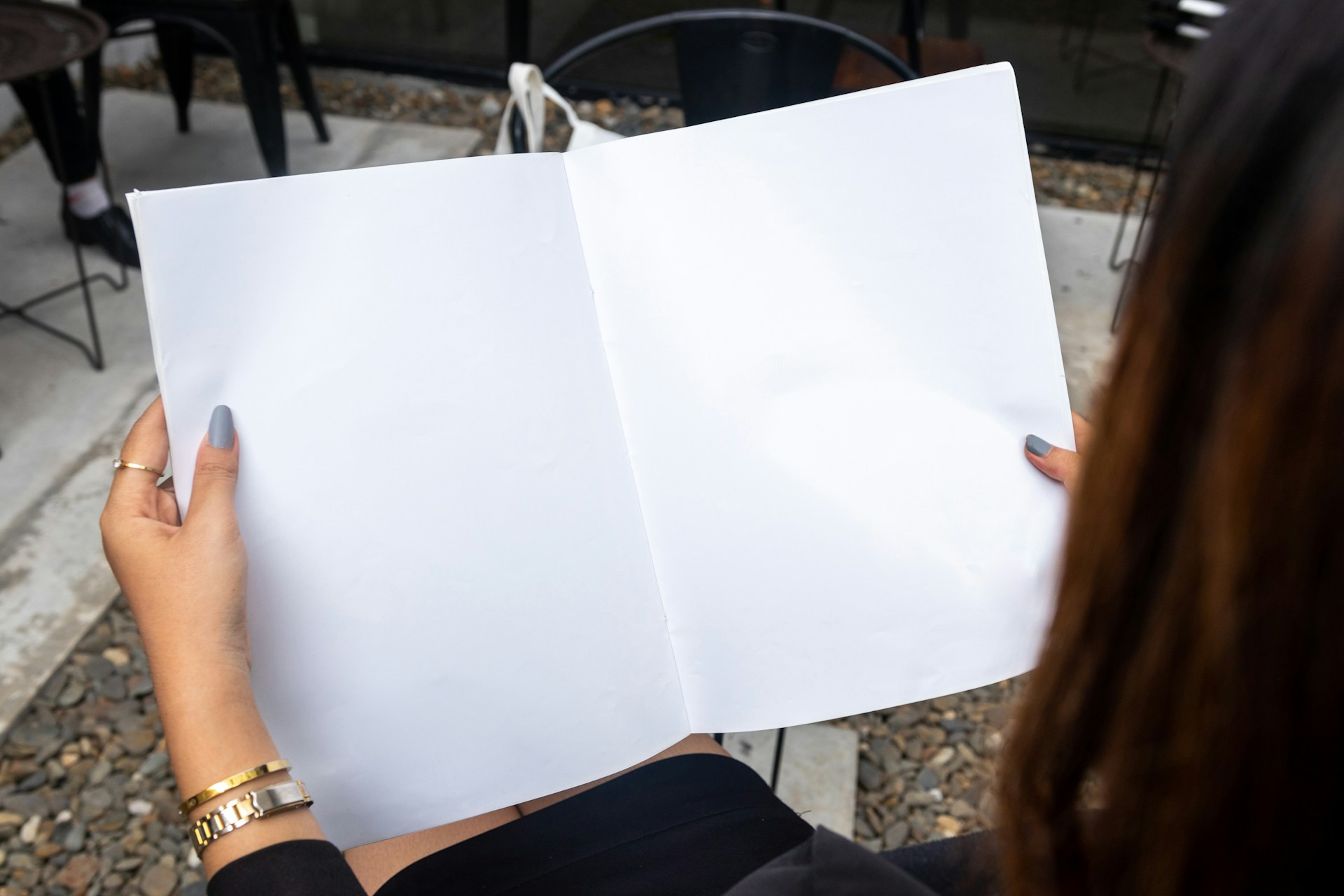 a woman holding a white piece of paper in her hands