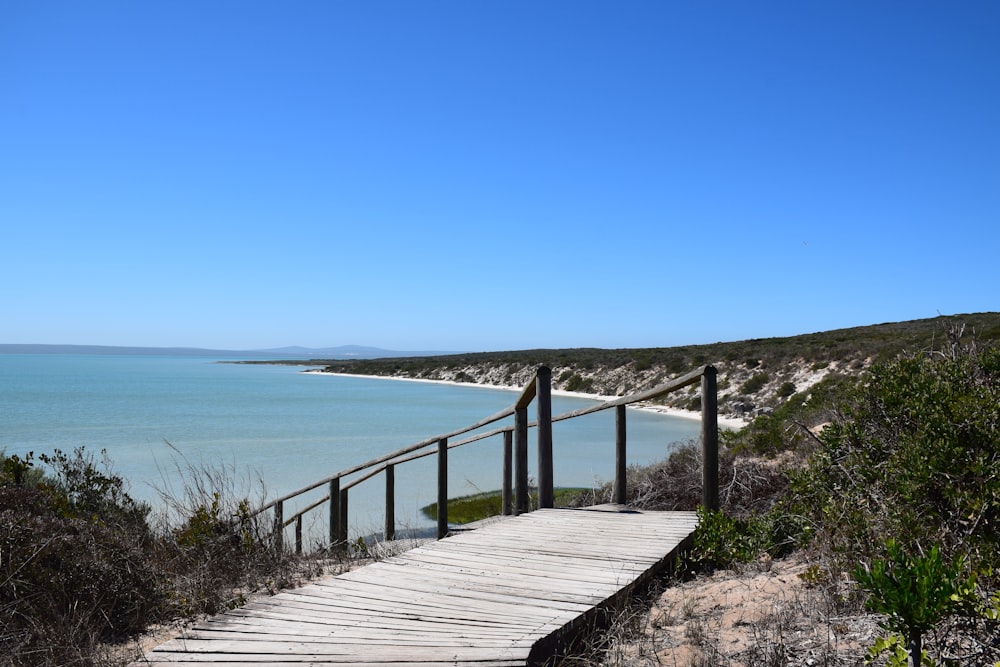 a wooden walkway leading to the beach