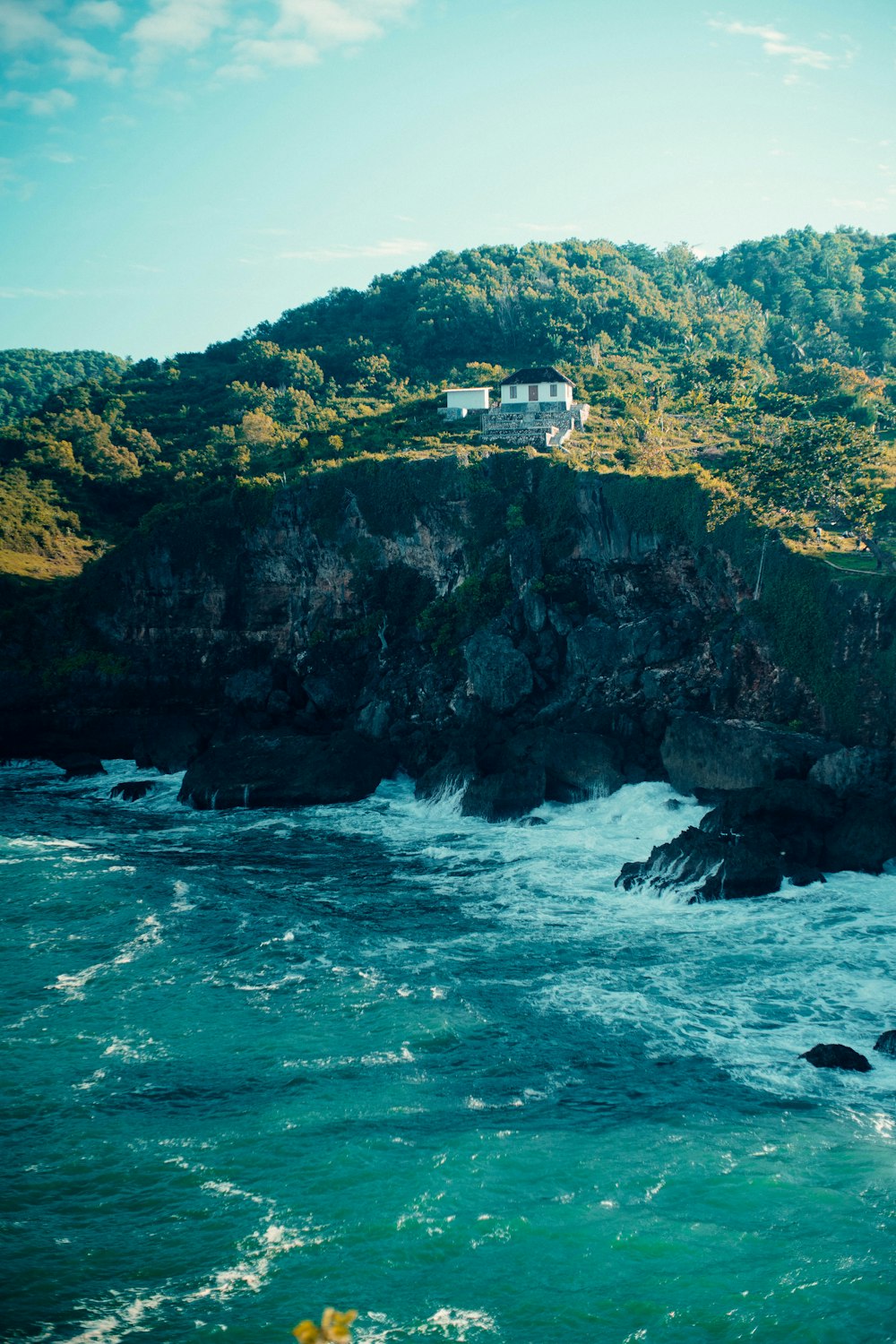 a house on a cliff overlooking the ocean