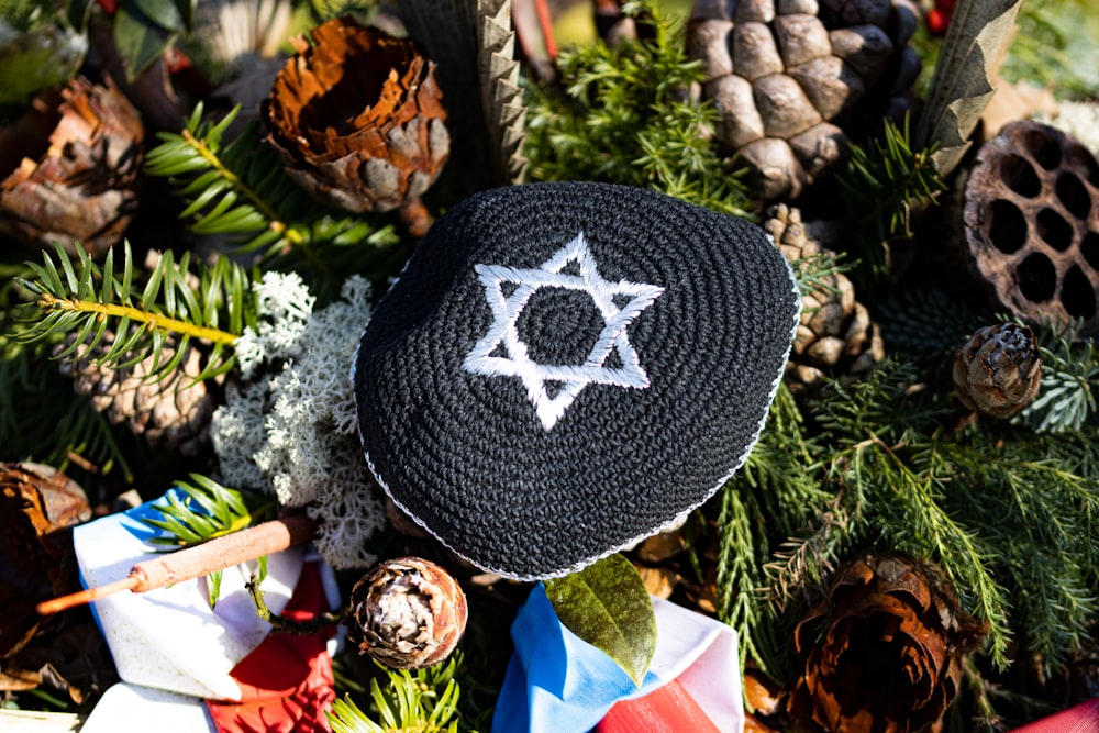 a crocheted hat with a star of david on it