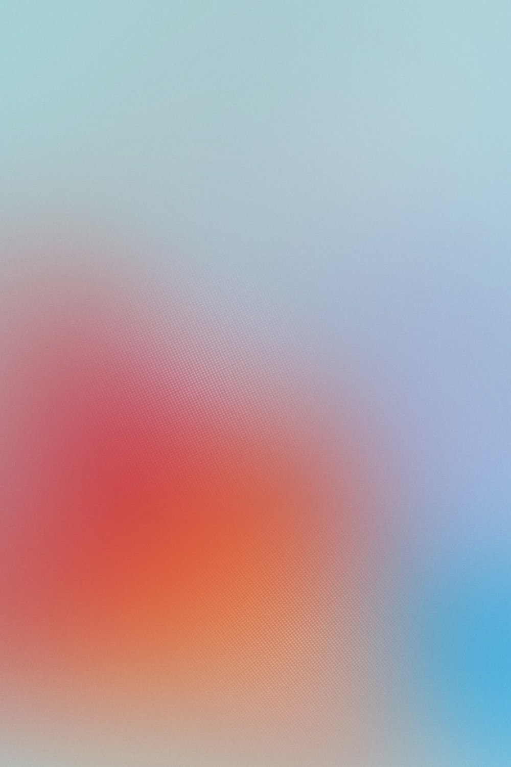 a blurry image of a red and blue background