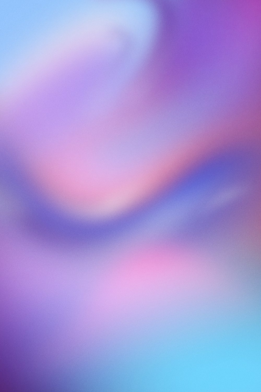 a blurry image of a purple and blue background