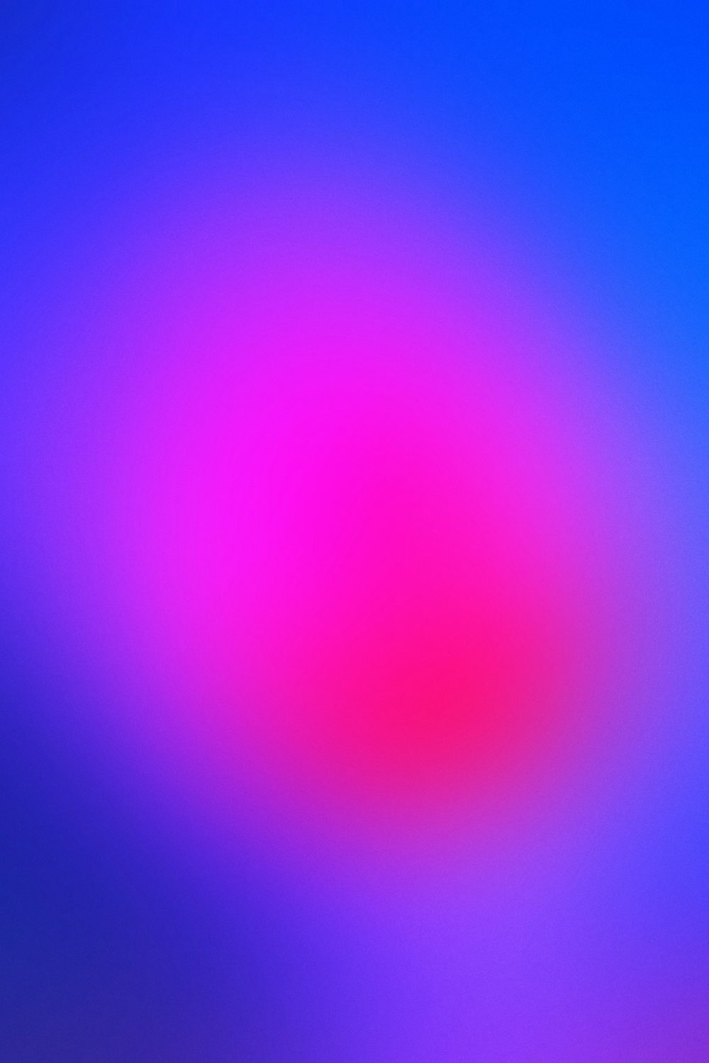 a blurry image of a blue and pink background