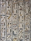 An intricate hieroglyphic inscription on a temple wall.