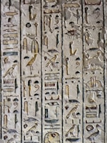 An intricate hieroglyphic inscription on a temple wall.