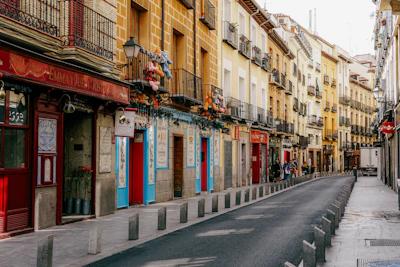 a street lined with tall buildings next to each other