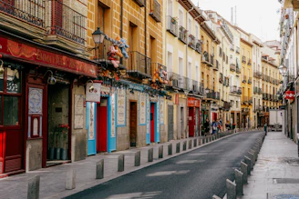 a street lined with tall buildings next to each other