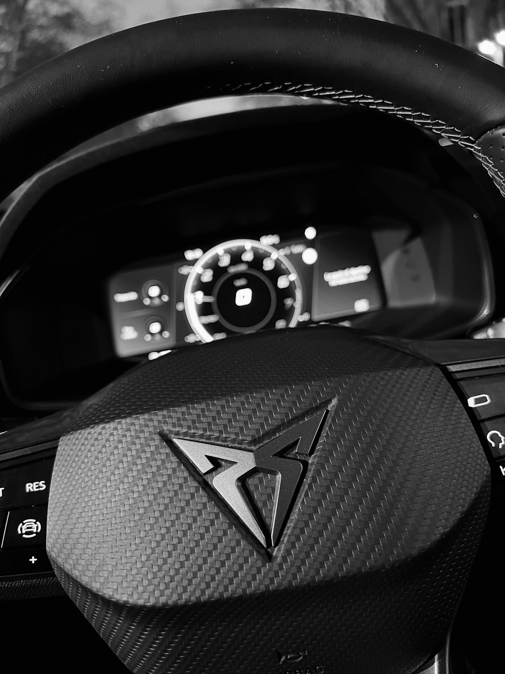 a close up of a steering wheel and dashboard of a car