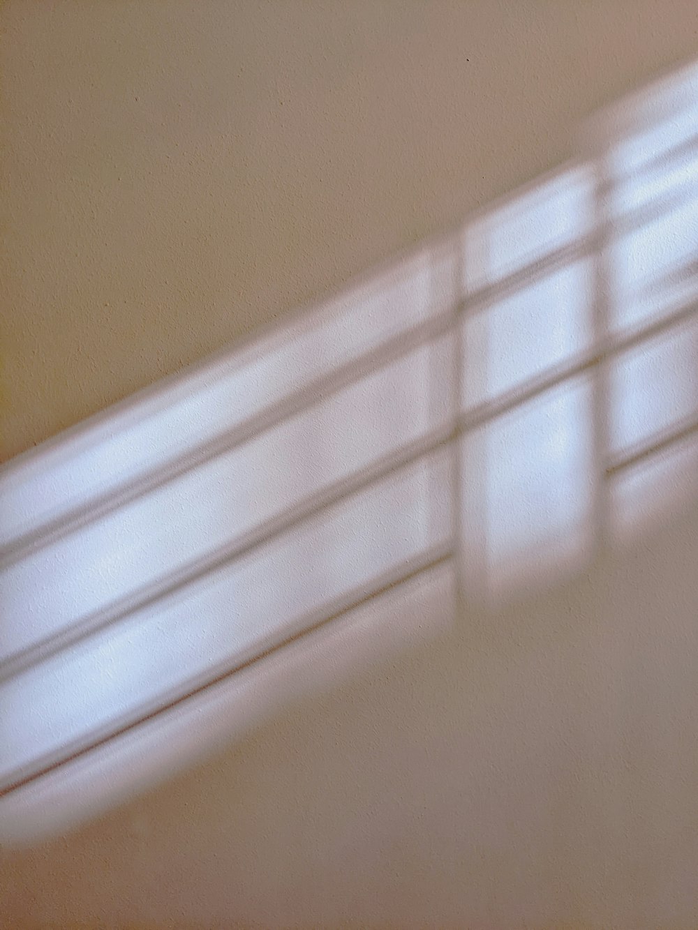 a blurry photo of a wall and a window
