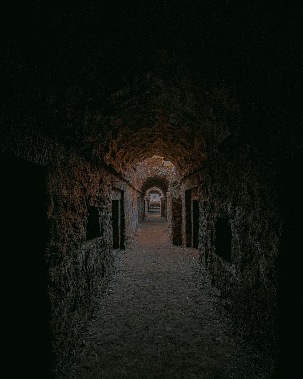 a dark tunnel with a light at the end