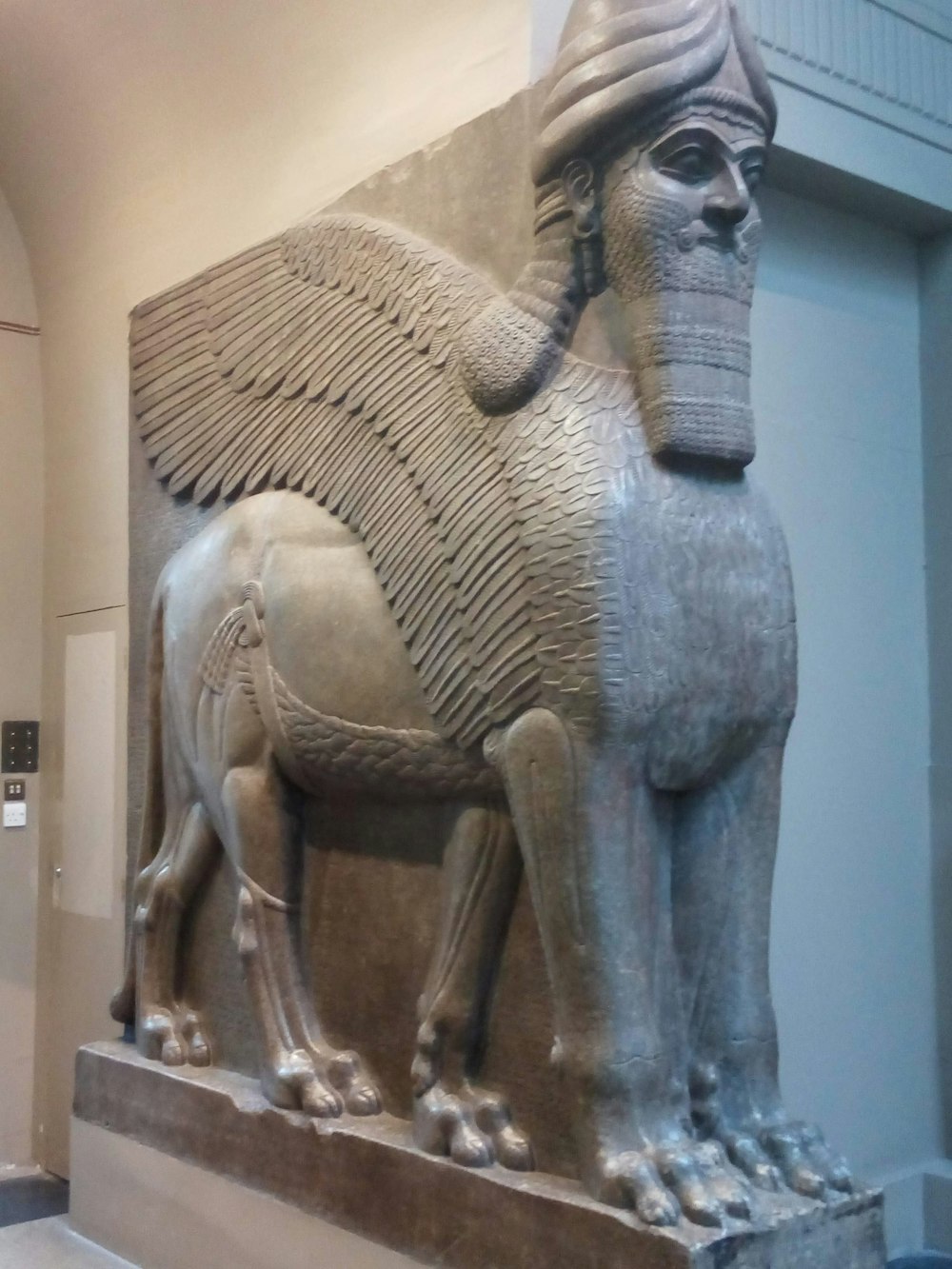 a statue of a horse with a helmet on it's head