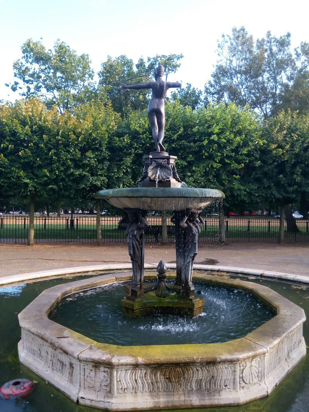 a fountain with a statue on top of it