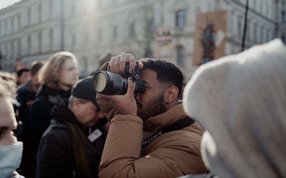 a man taking a picture of a group of people