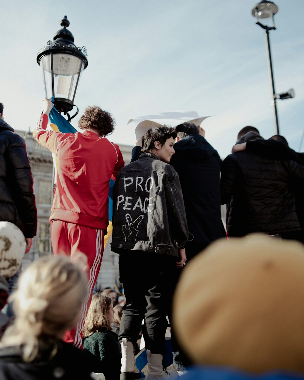 a group of people standing around each other