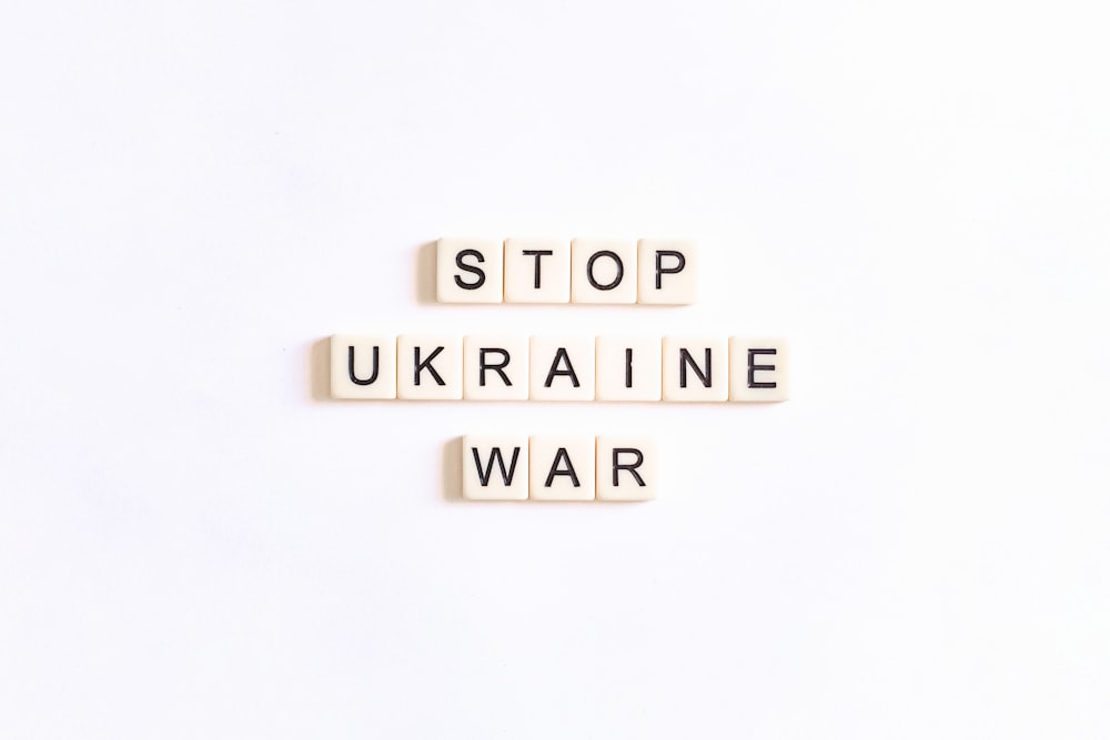 two scrabble tiles spelling stop ukraine war