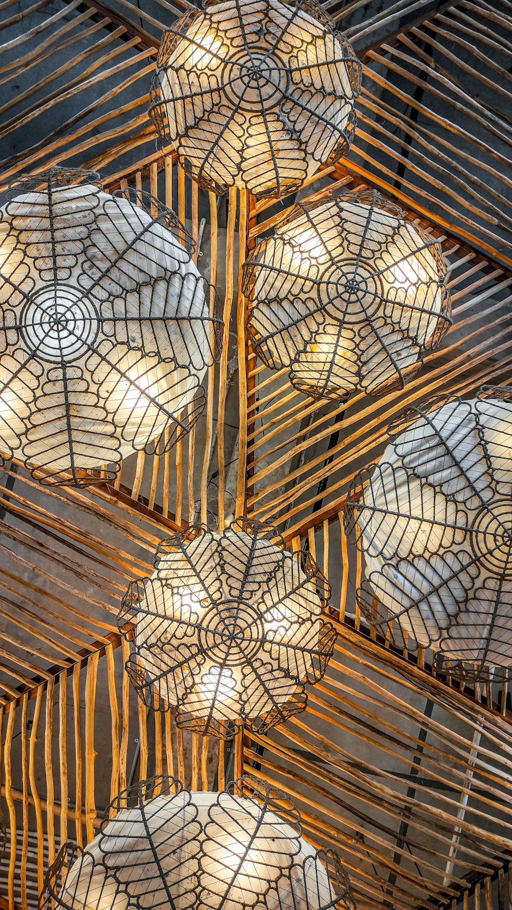 a bunch of umbrellas that are hanging from a ceiling