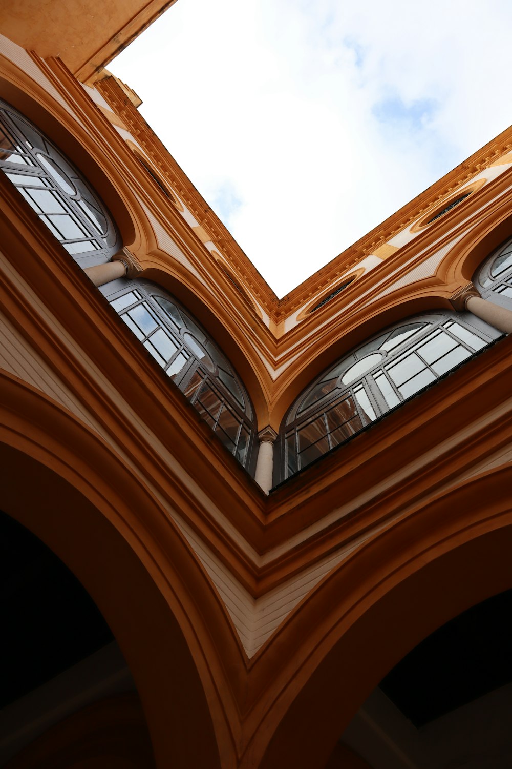 a view of the sky through a window in a building