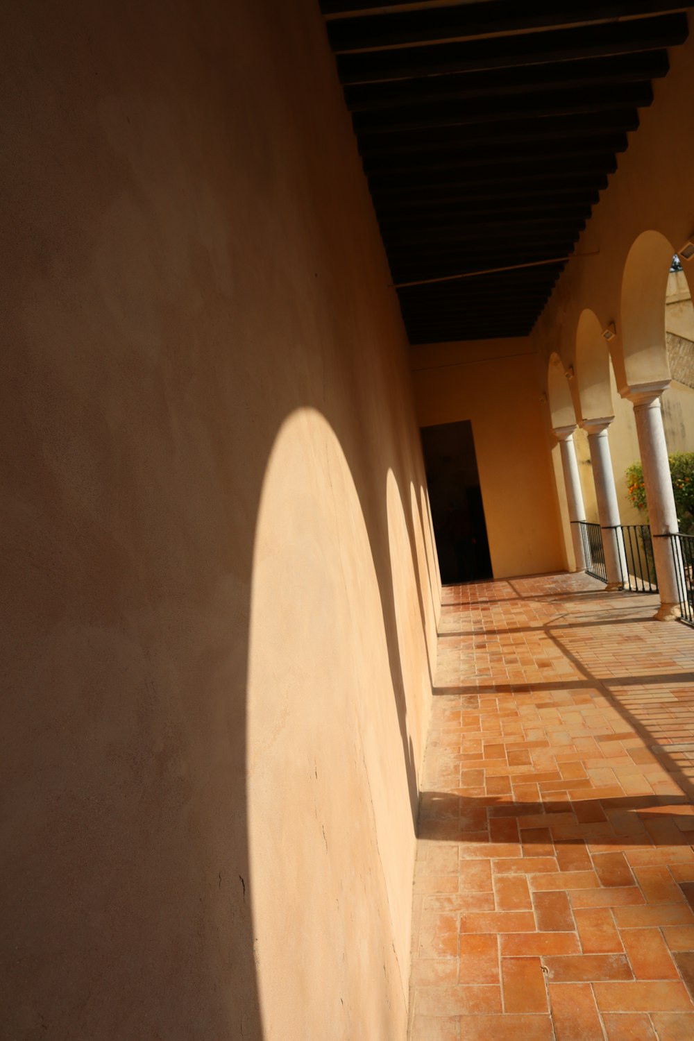 the shadows of a building on the side of a building