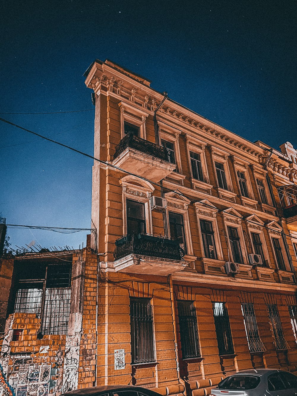 an old building with graffiti on the side of it