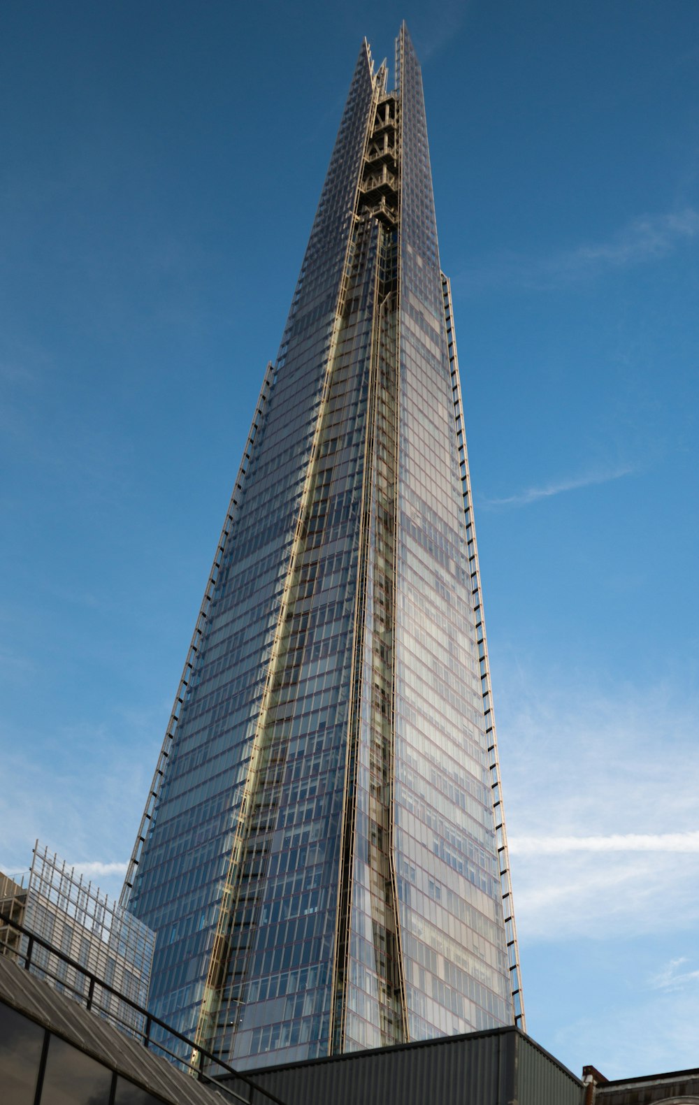 a very tall building with a sky background