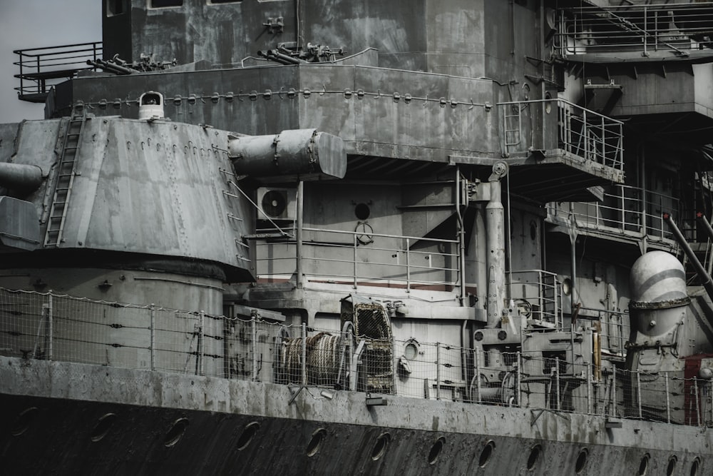 a large ship with a lot of pipes on it's side