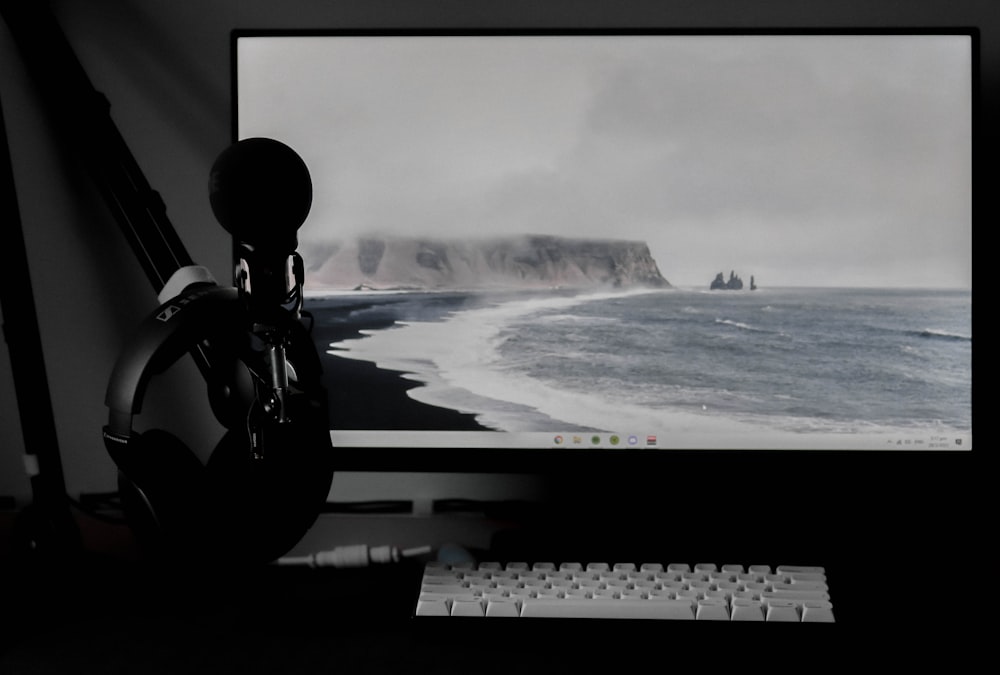 a computer monitor sitting on top of a desk