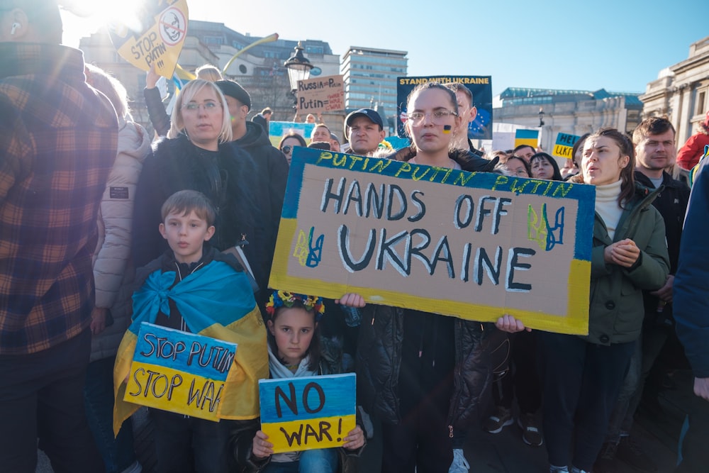 a group of people holding signs and protesting