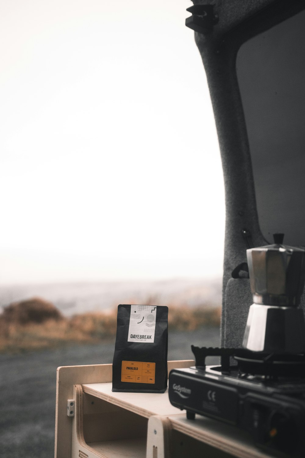 a coffee bag sitting on top of a wooden table