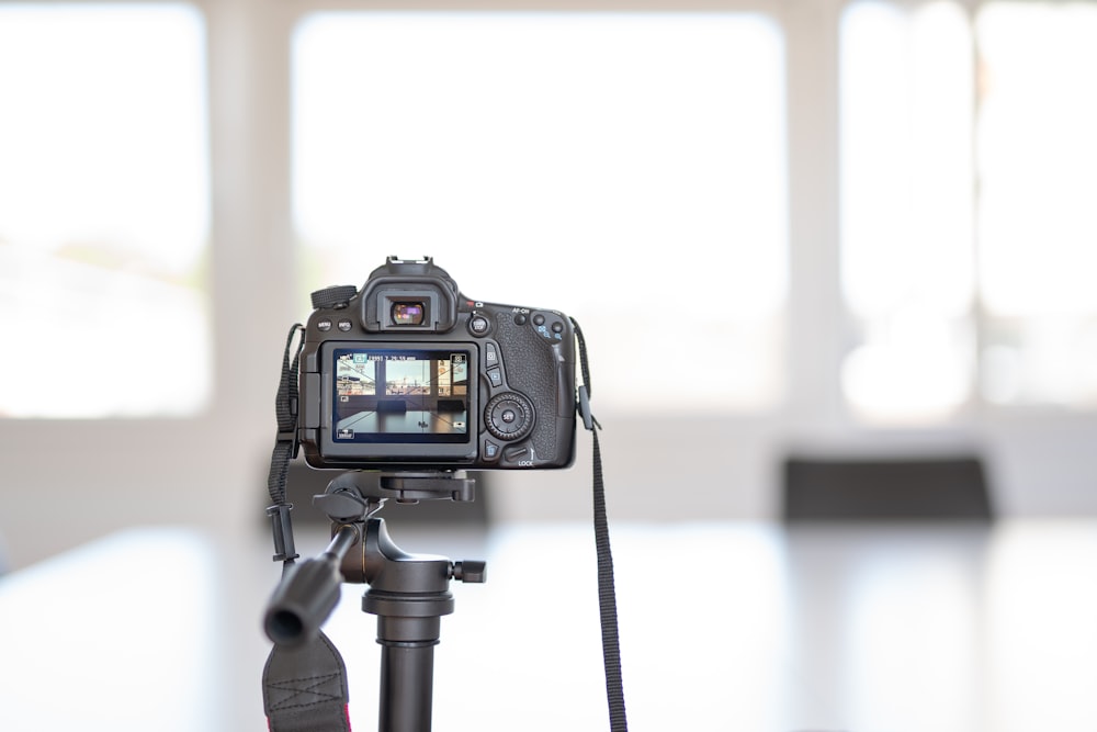 a camera sitting on top of a tripod