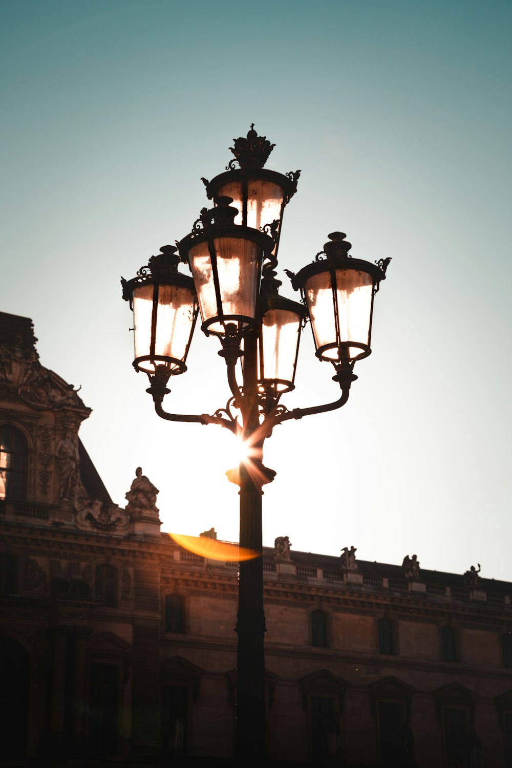 a street light with a building in the background