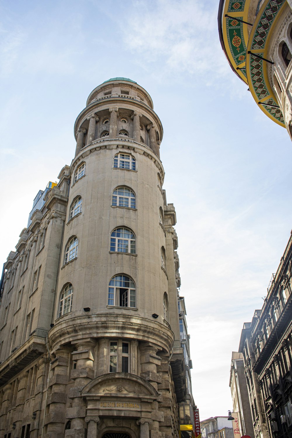 a tall building with a clock on the top of it