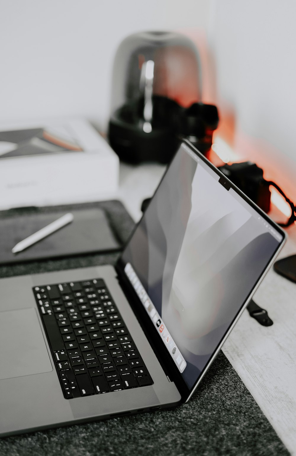 a laptop computer sitting on top of a table