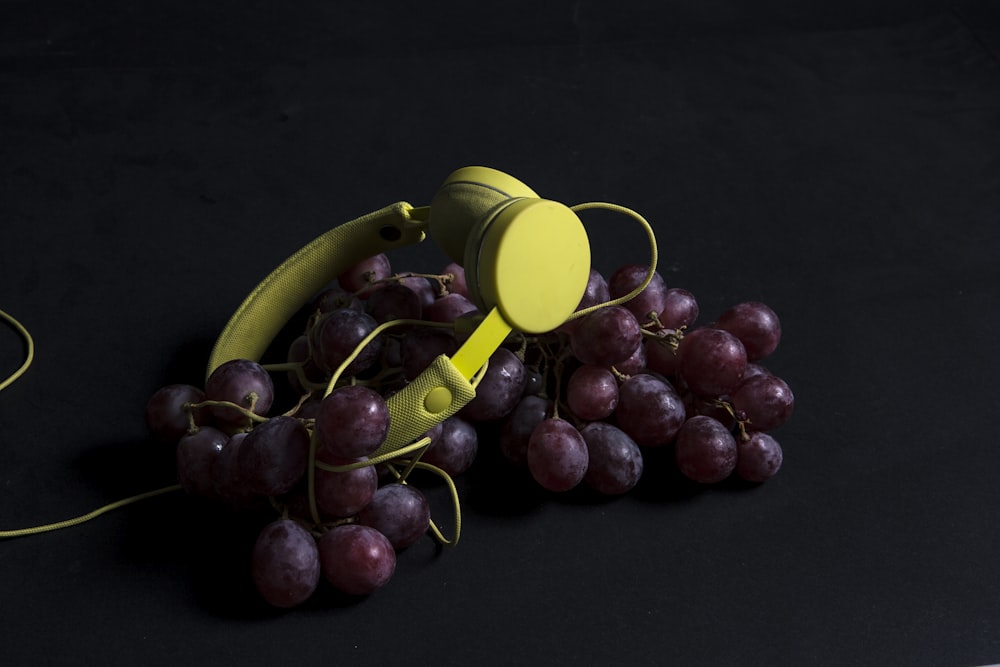 a bunch of grapes sitting on top of a table