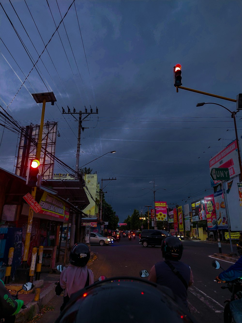 a city street at night with a traffic light