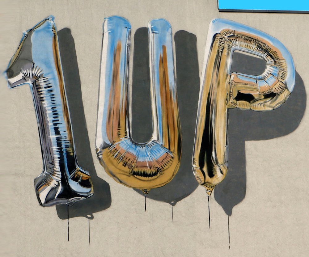 a group of balloons that spell out the word pop