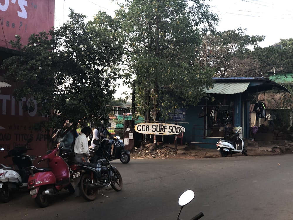 a group of motorcycles parked on the side of a road